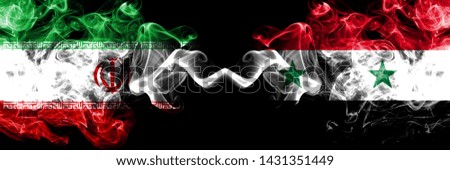 Iran vs Syria, Syrian smoky mystic states flags placed side by side. Thick colored silky smokes flag combination of Iranian and Syria, Syrian