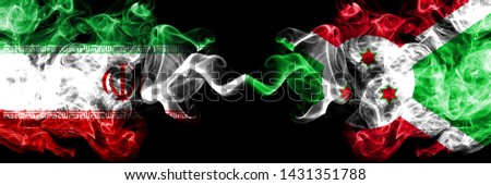 Iran vs Burundi, Burundian smoky mystic states flags placed side by side. Thick colored silky smokes flag combination of Iranian and Burundi, Burundian