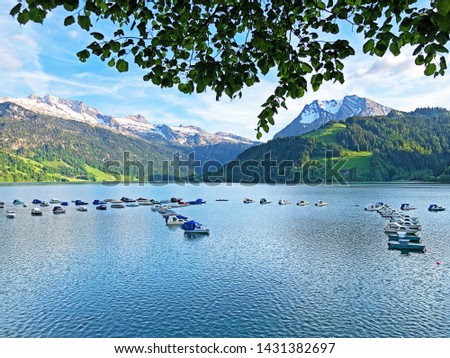 Boats on artifical alpine Lake Wagitalersee or Waegitalersee, Innerthal - Canton of Schwyz, Switzerland