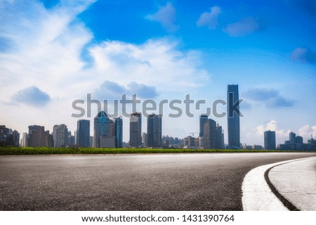 empty road with modern highrise in city,shanghai,China.