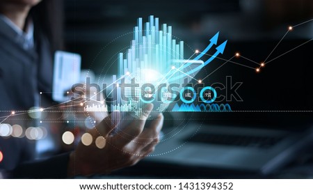 
 Businessman using mobile smartphone analyzing sales data and business growth graph chart. Digital marketing. business growth and progress.
