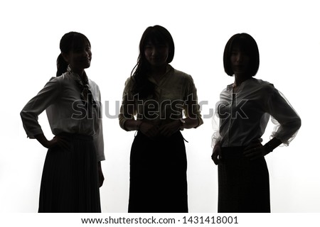 Silhouettes of group of young asian woman.