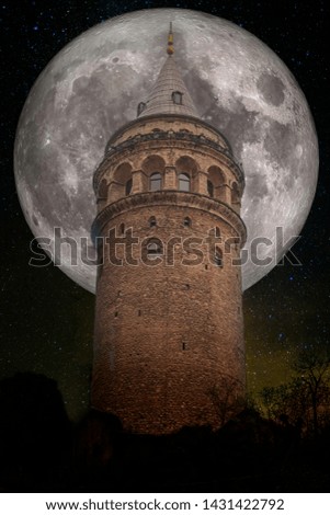 Galata tower, Istanbul at the full moon and starry night background. Elements of this image furnished by NASA.