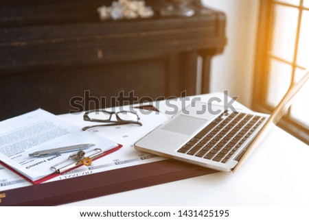 Business desktop with laptop, glasses, business schedule
