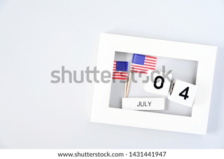 4th of July calendar and American Flag in picture frame Concept Happy Independence Day