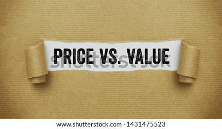 Torn brown paper revealing the words Price vs Value