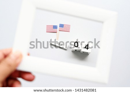 4th of July calendar and American Flag in picture frame Concept Happy Independence Day