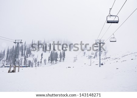 Ski lift with Beautiful Winter scene in  Gulmarg valley, Jammu & Kashmir India.