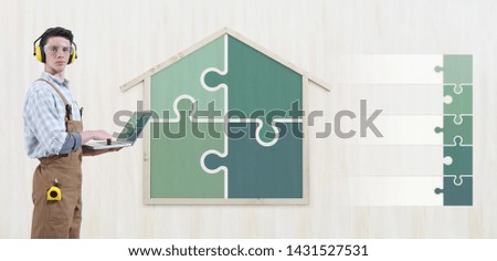 house construction renovation concept handyman carpenter man with laptop computer and puzzle infographic list empty symbols icons, isolated with the shape of a wooden house on background