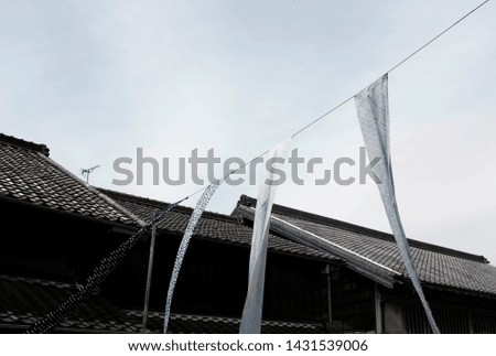 Shibori or tie-dyed fabrics flowing in the wind as part of the decoration in Arimatsu, Aichi, Japan during the annual Shibori Festival.