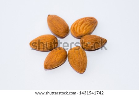 close up of  brown almonds seeds isolated on white background,clipping path.