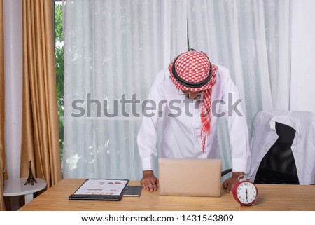  white dress,Arab businessman working and documents on the table