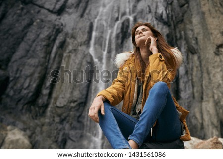 woman in a jacket trip nature