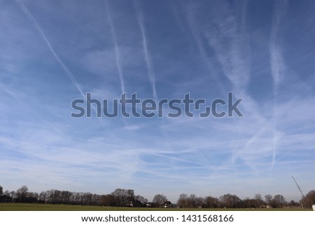 blue sky with airplane stripes