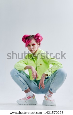woman in stylish green jacket squats