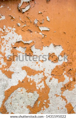 Empty old orange wall texture. Painted distressed wall surface. Grungy wide concrete wall. Grunge stonewall background. Shabby building facade with damaged plaster. Abstract web banner. Copy Space.