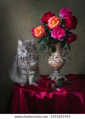 Floral still life with adorable gray kitty