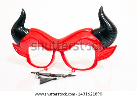 devil disguise masquerade glasses isolated on a white background.