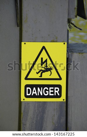 High voltage sign on the power line. Danger.