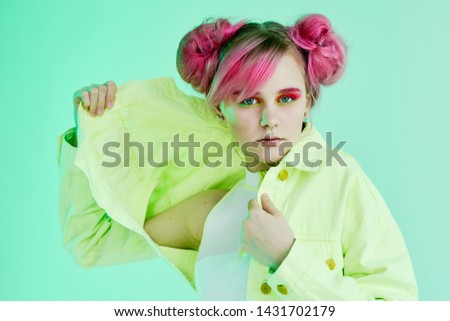 woman with pink hair in green jeans