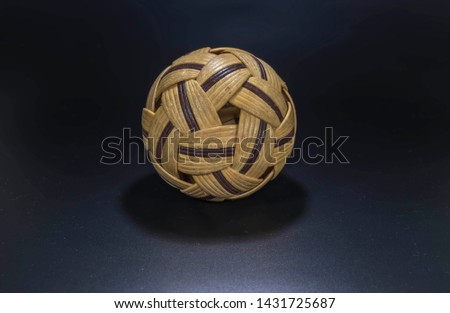 Takraw ball isolated in black background
