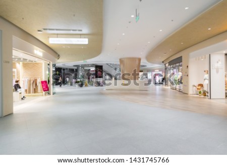 Abstract blur and defocused shopping mall in department store interior for background Royalty-Free Stock Photo #1431745766