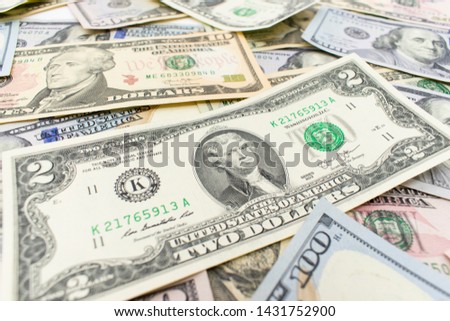 Dolar.  American money background texture bills of 2 american dollars. two dollar bill on dollar money background.