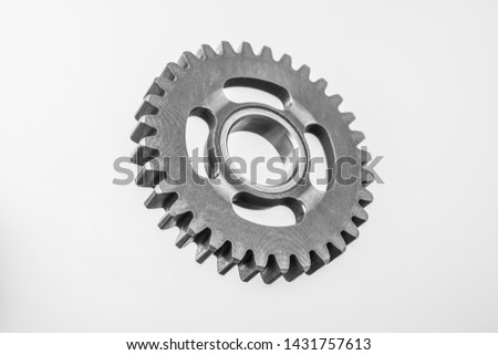 Design concept - top view of metal gear isolated on white background for mockup. real photo, not 3D render