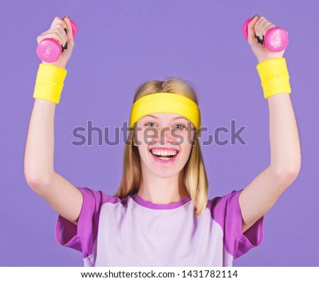 Woman exercising with dumbbells. Easy exercises with dumbbells. Workout with dumbbells. Ultimate upper body workout for women. Girl hold dumbbells wear bright wristbands. Vintage sport concept.