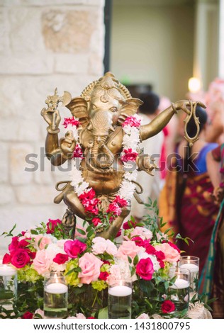 Hindu Lord Ganesh Ganapati Statue with Flowers