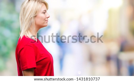 Young beautiful blonde woman wearing red t-shirt over isolated background looking to side, relax profile pose with natural face with confident smile.