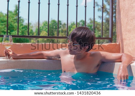 Men soak in the water bath On the bright sky.