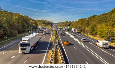 Afternoon motor Traffic on the A12 Motorway seen from above. This is one of the Bussiest highways in the Netherlands Royalty-Free Stock Photo #1431884141