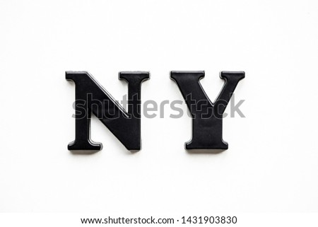 The inscription New York in black bulk letters on a white background. Photo of the lettering