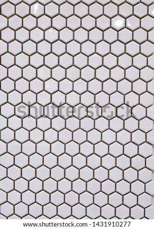 Photo top view of a multicolored mosaic for hexagon-shaped walls with ceramic shine and texture as a textured background