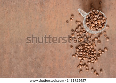 Coffee beans on rusty, scratched metal
