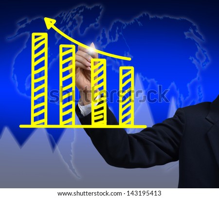 businessman hand drawing a graph.