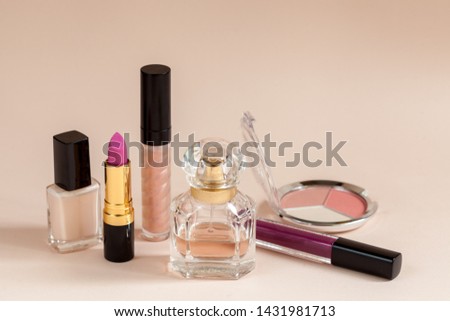 Decorative cosmetics on beige background