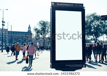Clear Billboard on city street with blank copy space screen for advertising or promotional poster content,empty mockup Lightbox for information,blank display outdoors in urban area with people walking
