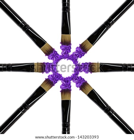 Professional make-up brush on purple crushed eyeshadow