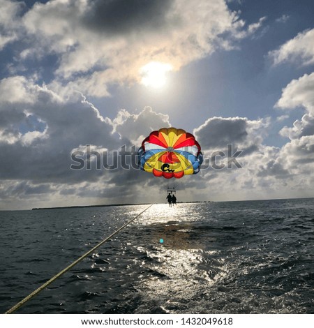 Parasailing over picture perfect water and sky