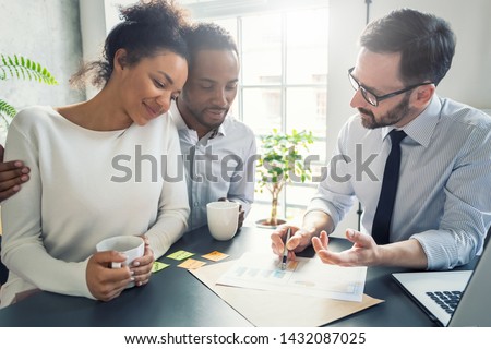 Family couple consultations with a lawyer or insurance agent. Law and insurance. Royalty-Free Stock Photo #1432087025