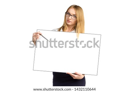 young business woman in glasses is holding blank board isolated on white background. Attractive girl points pen to blank white placard