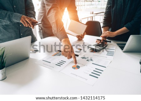 Business people analyzing investment graph meeting brainstorming and discussing plan in meeting room, investment concept Royalty-Free Stock Photo #1432114175