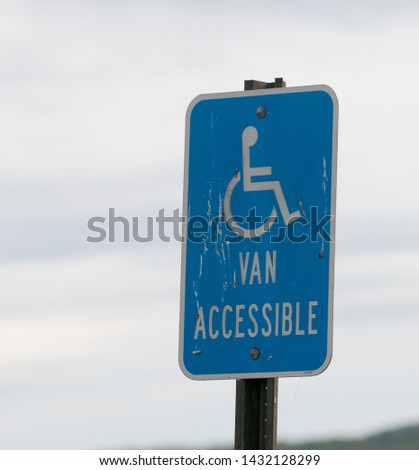 van accessible blue information sign