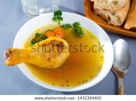 Image of tasty scottish traditional soup cock-a-leekie with chicken, bacon and leek Royalty-Free Stock Photo #1432304405