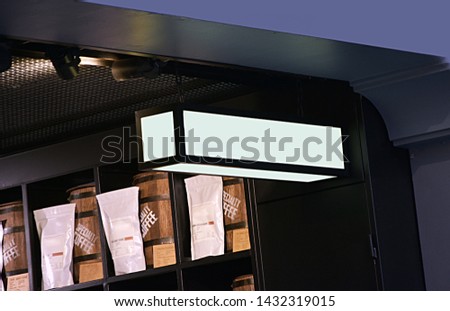 Empty white circle and hollow square shop signboard layout. Lightbox attached to the wall on the street. Model. 3d render of mockup signboard and blank cafe signboard