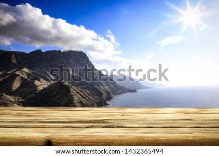 Desk of free space and summer background of beach. 