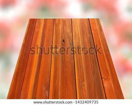 Vertical planks with blurry flowers for background