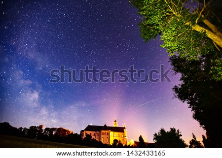 Midsummer Milky Way and satellite light in the night sky.